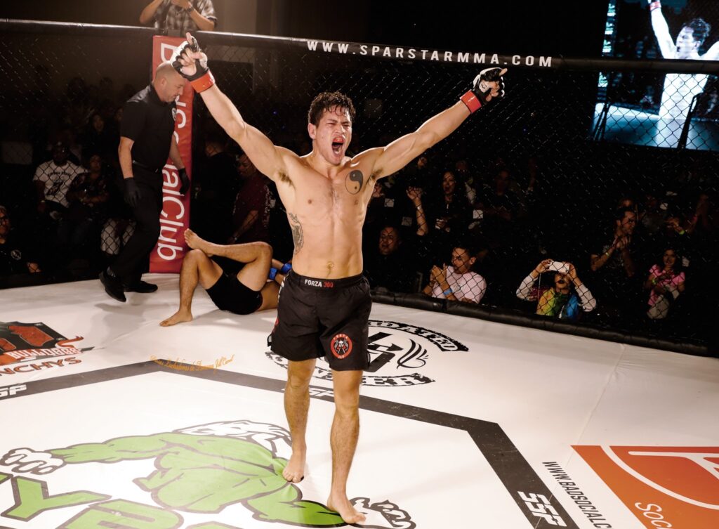 Johnny raising hands in victory after winning California state championship