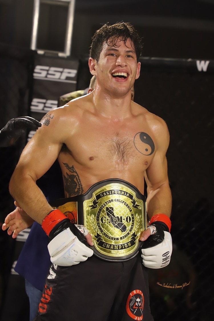 Johnny posing with California amateur featherweight championship belt